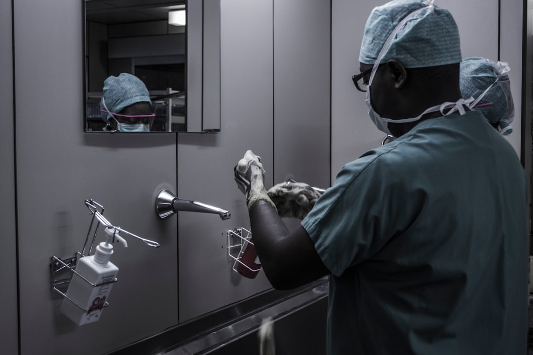 Medical professional in protective gear working in a sterile environment, symbolizing the application of AI in healthcare